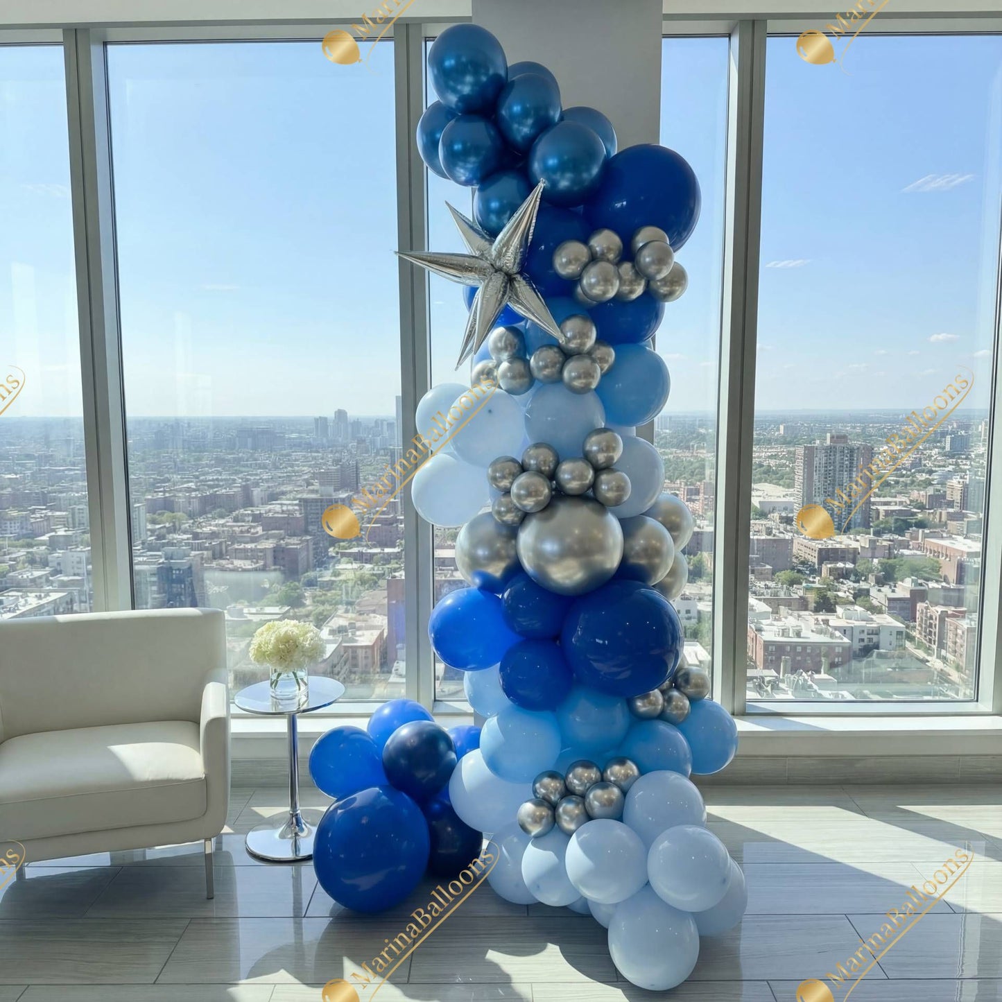 A modern blue-and-silver balloon column with metallic accents - a striking decor piece for corporate events, birthday parties, and photo zones.