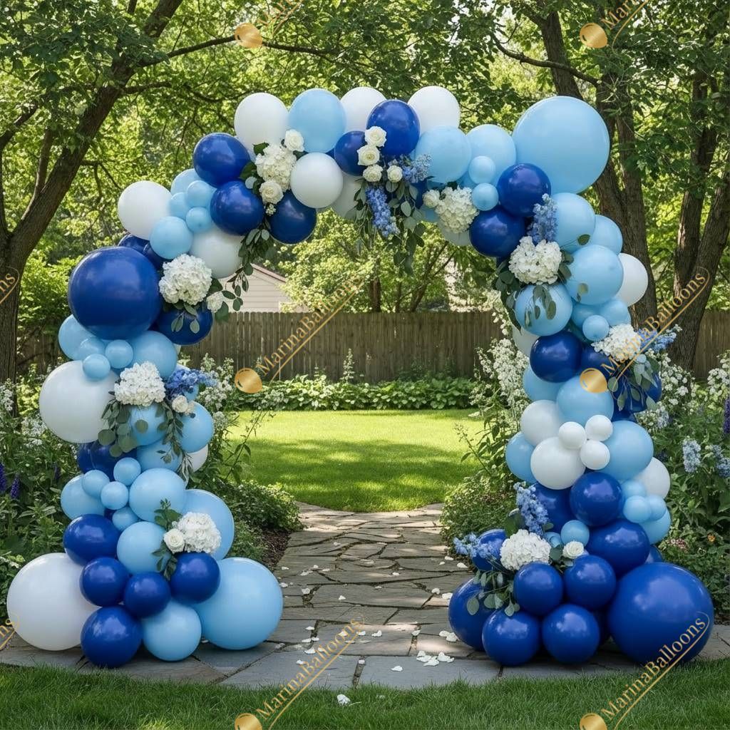 A fresh blue-and-white balloon arch with elegant florals - perfect for outdoor celebrations and photo moments.