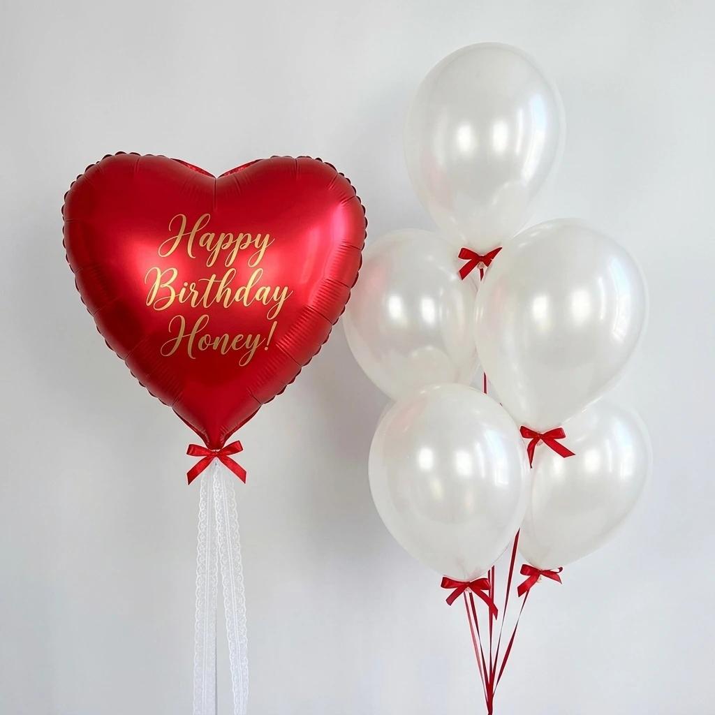 Red heart balloon with white balloons