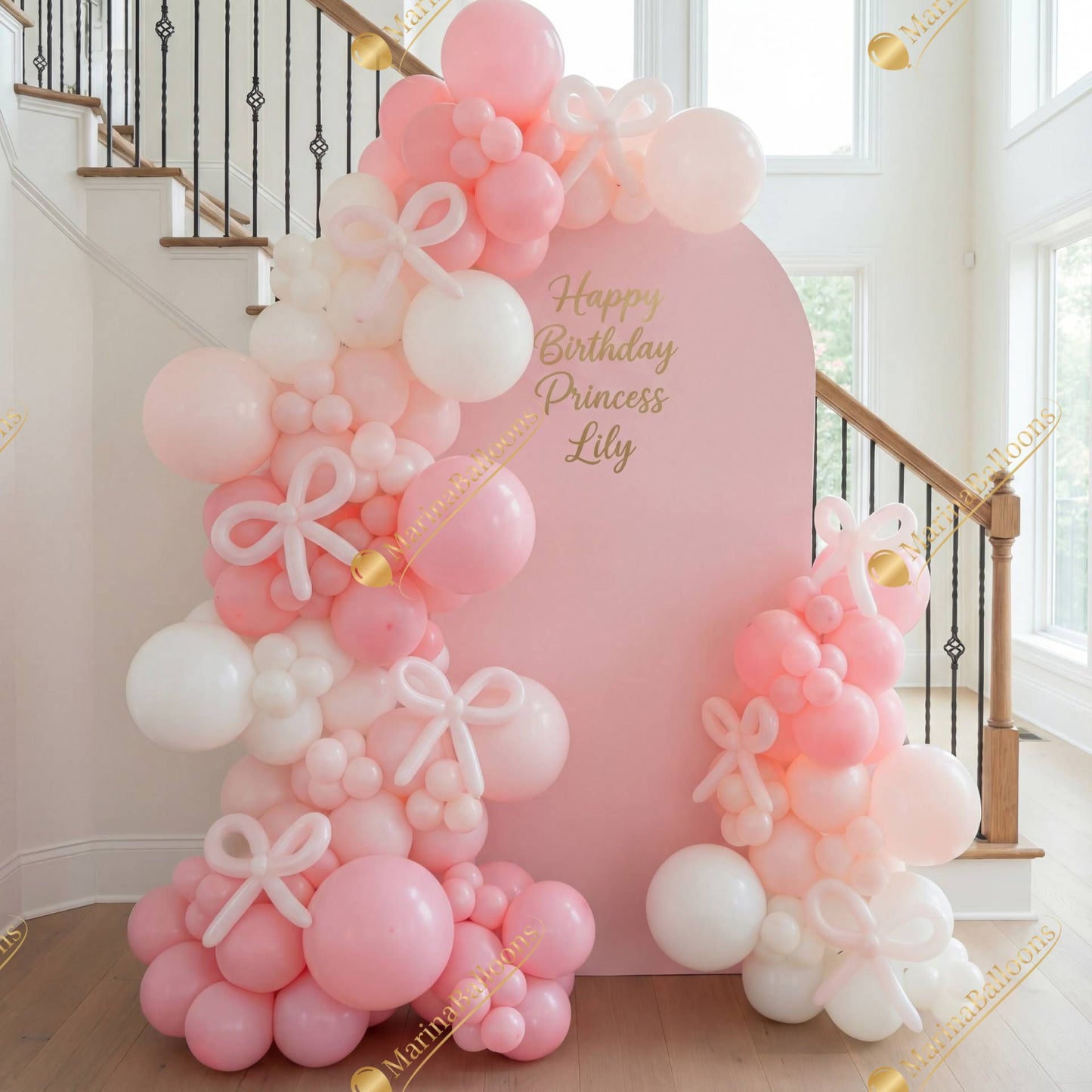 A charming pastel balloon backdrop with bows - a dreamy photo zone for a little princess’s special day.