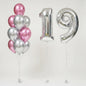 A set of party balloons including a cluster of metallic pink and silver latex balloons, a large silver foil balloons shaped like the numbers 19!