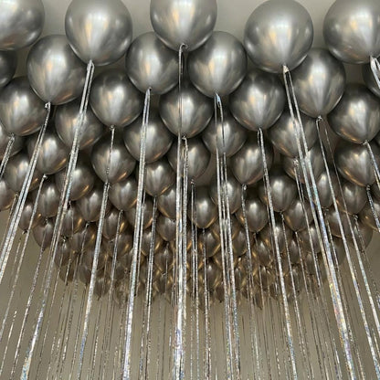 Helium ceiling balloons with long shimmer ribbons for an LA proposal or anniversary