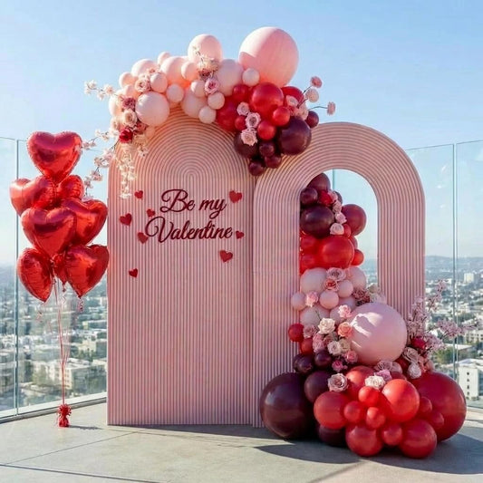 Pink and red heart balloon photo zone for a Valentine's Day event in Los Angeles
