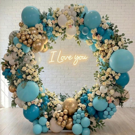 Ring-shaped balloon arch with floral accents for a Westside LA proposal, wedding, or quinceañera