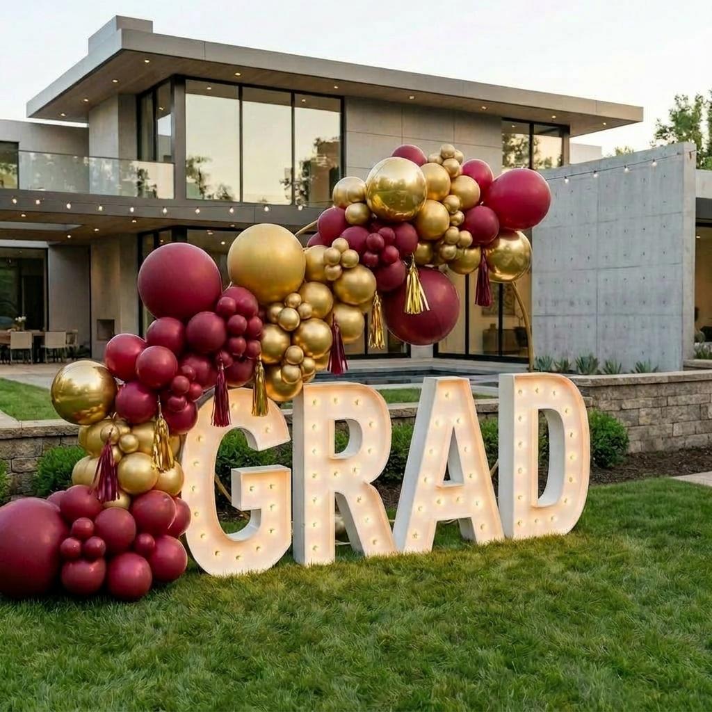 Luxe graduation marquee setup with year numbers — a Westside LA graduation party photo backdrop