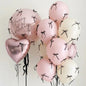 Pink balloons with bows
