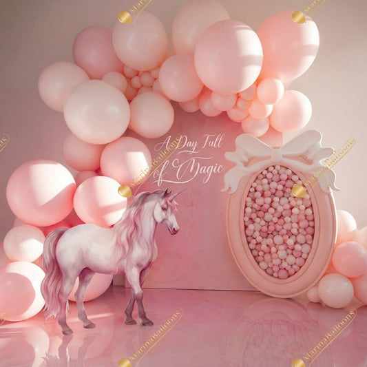 A soft pink magical setup with dreamy balloons and a graceful unicorn - the perfect backdrop for a fairytale birthday.