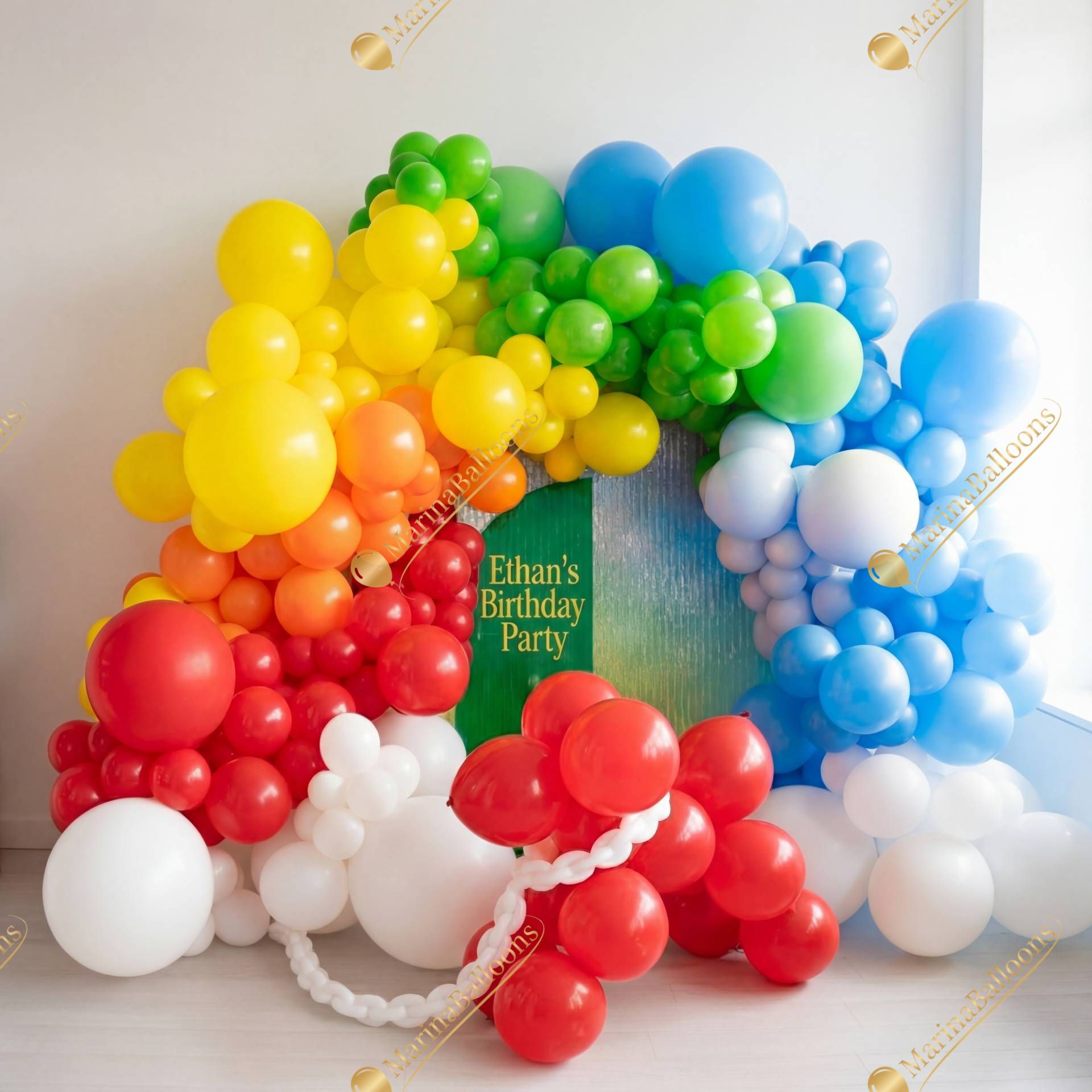 A bright and joyful rainbow balloon arch - a vibrant, colorful setup for a fun and energetic kids’ birthday celebration.