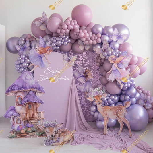A dreamy fairy-garden setup in soft lavender tones with whimsical fairies, butterflies, woodland animals, and elegant balloon decor - the perfect magical backdrop for a little girl’s birthday.