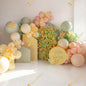 A sweet pastel balloon installation with floral details - a soft and cheerful photo zone for a little girl’s birthday.