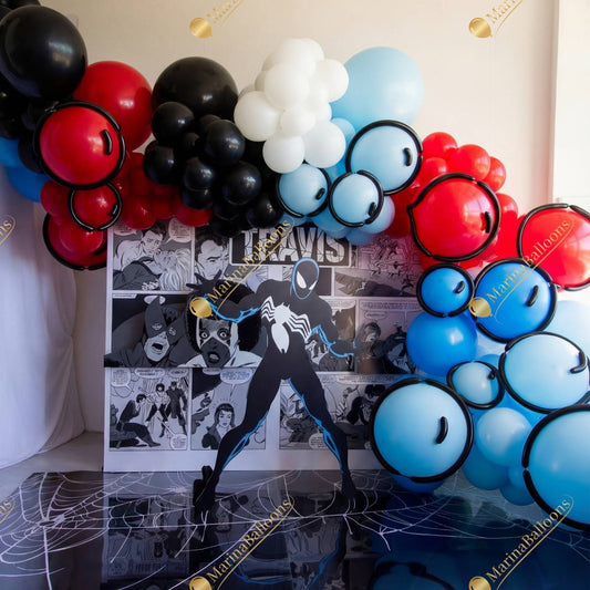 A bold Spider-Man–inspired setup with comic-style backdrops, vibrant balloons, and striking superhero details - the perfect photo zone for a hero-themed birthday party.