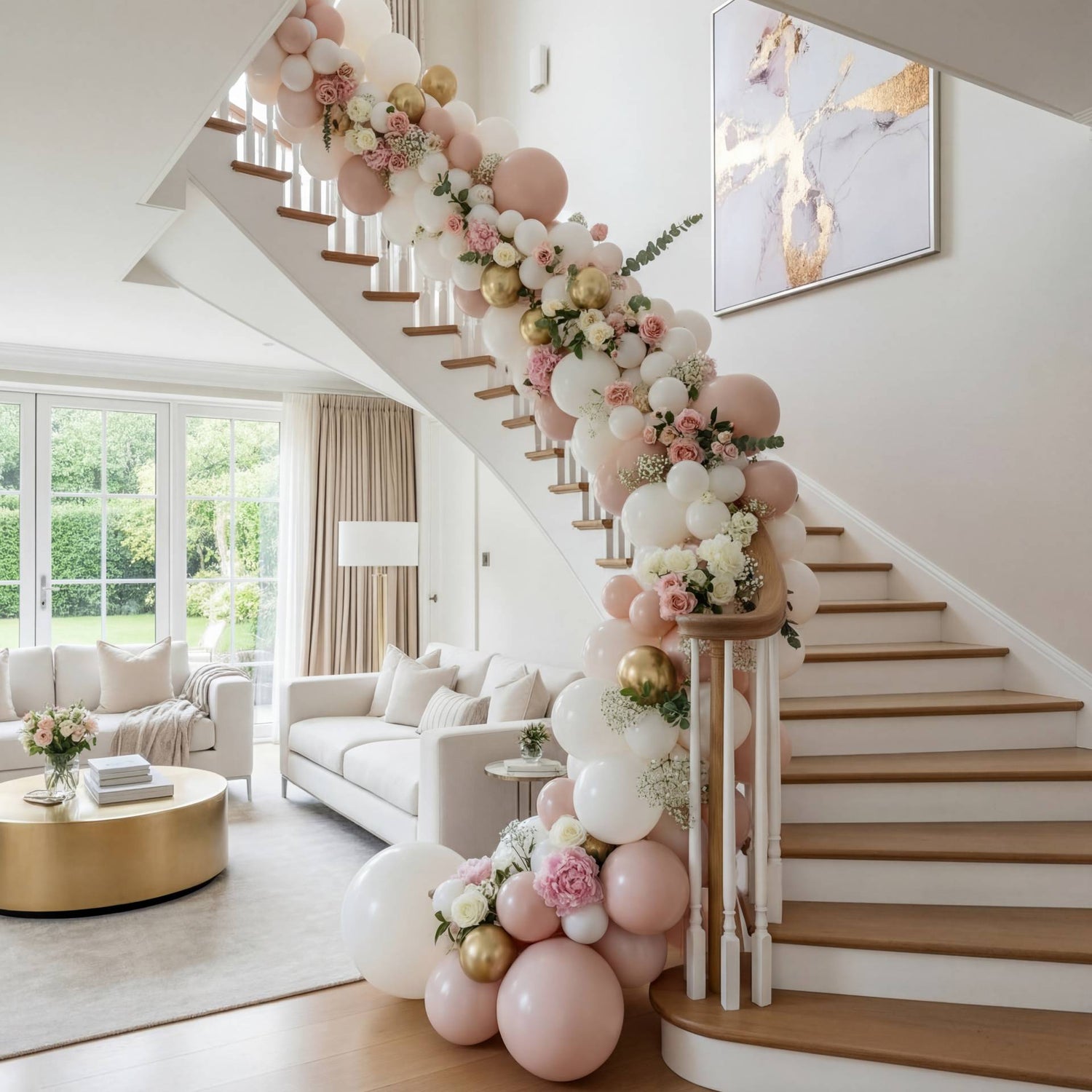 A romantic staircase balloon garland in soft pinks and whites with lush florals - a beautiful addition to home celebrations and intimate events.