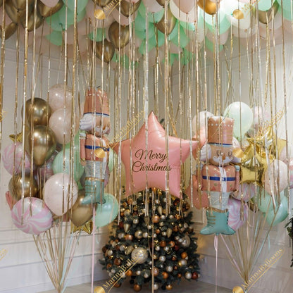 A soft pastel Christmas setup featuring floating ceiling balloons, golden ribbons, and adorable Nutcracker characters. Delicate, magical, and full of holiday charm - the perfect backdrop for kids’ celebrations, family photos, and festive winter events.