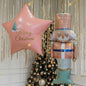 A soft pastel Christmas setup featuring floating ceiling balloons, golden ribbons, and adorable Nutcracker characters. Delicate, magical, and full of holiday charm - the perfect backdrop for kids’ celebrations, family photos, and festive winter events.